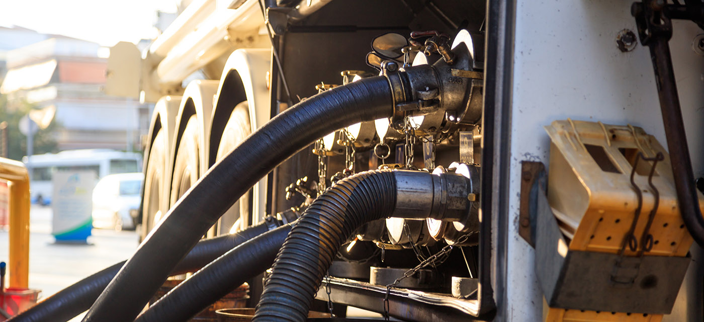 Tanker truck at the service station. fuel-tanker-filling-tanks